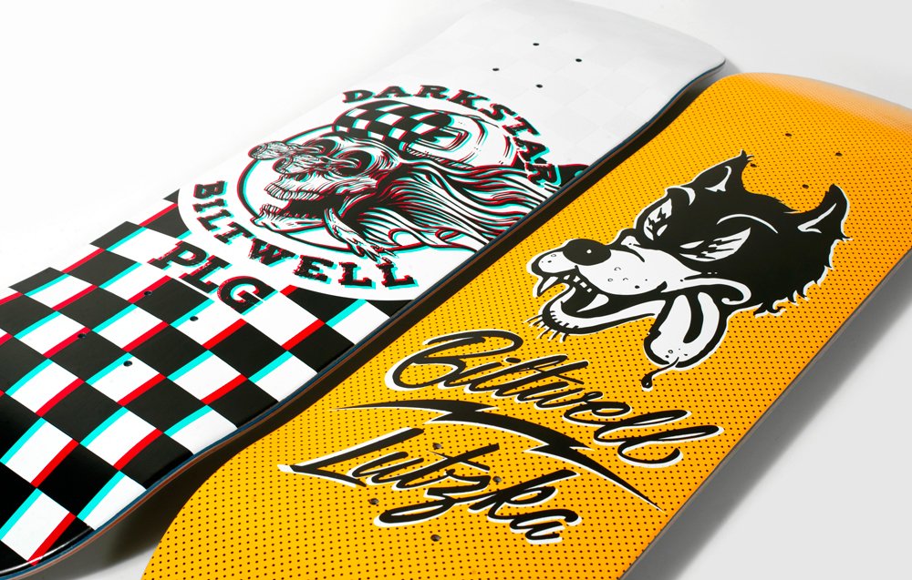 Two Biltwell x Darkstar skateboard decks: a checkered skull deck and a yellow deck with a cartoon wolf