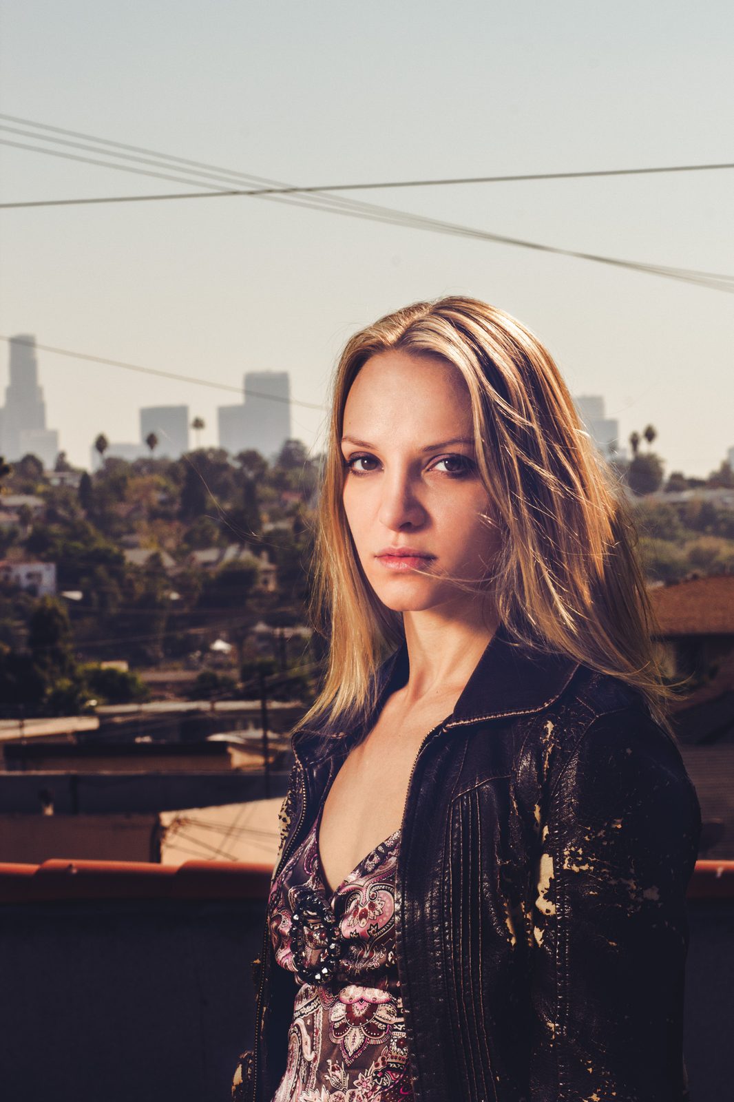 Portrait on a rooftop with the Los Angeles skyline behind